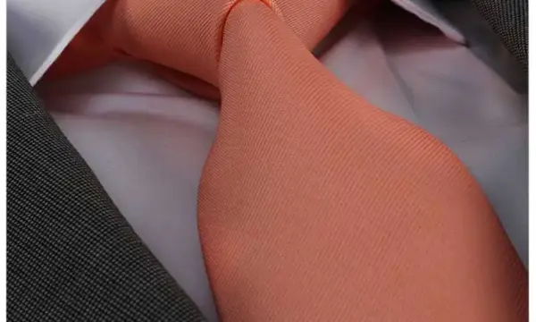 Peach solid tone jacquard woven tie